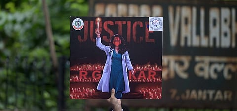 A placard held by a doctor during a protest over the sexual assault and murder of a postgraduate trainee doctor in Kolkata