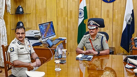 Outgoing Kolkata police commissioner Vineet Goyal (left) during handover of charge to new Kolkata Police Commissioner Manoj Kumar Verma, at the Kolkata police headquarter