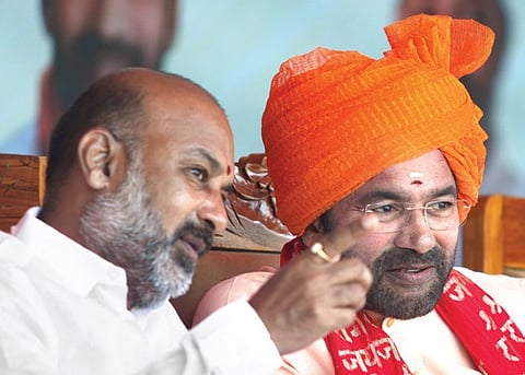 MoS for Home Affairs Bandi Sanjay Kumar and Union Mines Minister G Kishan Reddy watch the march-past during the Liberation Day celebrations at Parade Grounds in Hyderabad