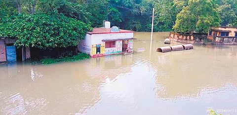 Houses submerged in floodwater at a village in Balasore district
