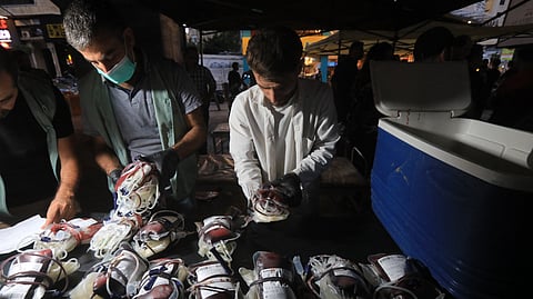 Medics collect blood donations in Beirut's southern suburb on September 17, 2024, after explosions hit locations in several Hezbollah strongholds around Lebanon amid ongoing cross-border tensions between Israel and Hezbollah fighters.