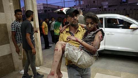 An injured girl is brought to the Naser hospital for treatment following an Israeli strike near Khan Yunis in the southern Gaza Strip on September 18, 2024.