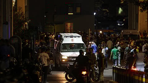 Ambulances are surrounded by people at the entrance of the American University of Beirut Medical Center, on September 17, 2024, after explosions hit locations in several Hezbollah strongholds around Lebanon amid ongoing cross-border tensions between Israel and Hezbollah fighters.