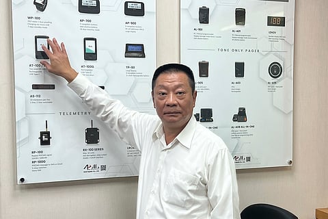 Hsu Ching-kuang, chairman of Apollo Gold, talks about the Taiwan company's communication products at the headquarters in New Taipei City.