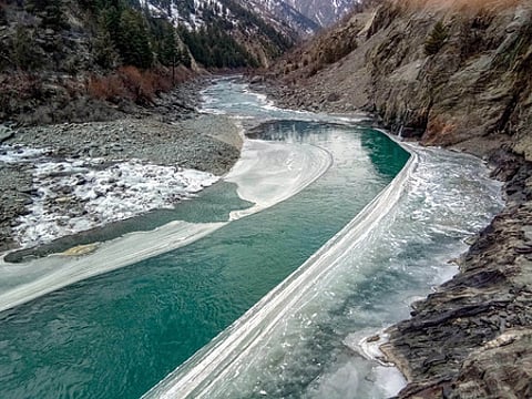 River Chenab seen in semi-frozen condition even after cold wave conditions slightly subsided and minimum temperature increased