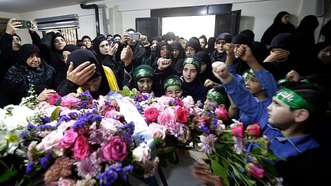 Relatives mourn Fatima Abdallah, a 10-year-old girl killed after hundreds of paging devices exploded in a deadly wave across Lebanon