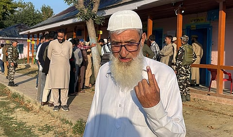 An elderly voter shows his finger marked with indelible ink after casting vote during the first phase of Jammu and Kashmir Assembly elections, at Kakapora, in Pulwama district, Wednesday, Sept. 18, 2024.