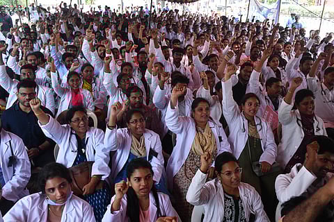 Members of AP PHCs doctors association stage a protest demanding to revoke GO 85 at Dharna Chowk in Vijayawada on Tuesday.