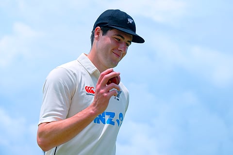 New Zealand's William O'Rourke shows the ball in his hand as he celebrates his 5-wicket haul at the end of the Sri Lanka innings on the second day of the first cricket test match between New Zealand and Sri Lanka in Galle.