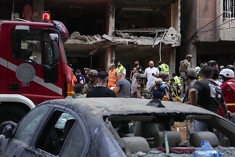 Rescuers work at the scene of an Israeli missile strike in the southern suburbs of Beirut, Friday, Sept 20, 2024.