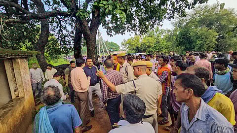 Police personnel investigate after eight people, including some school children, were killed and one person was injured after being struck by lightning, at a village in Rajnandgaon district.