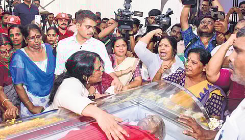 Former CPM central committee member and LDF convener M M Lawrence’s daughter Asha beside his body at the Ernakulam Town Hall on Monday