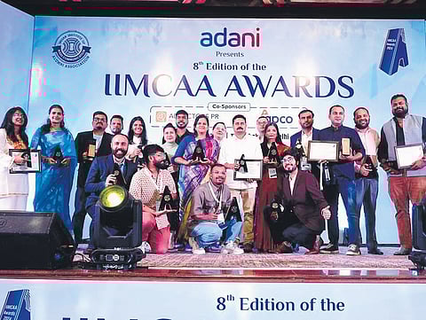 Winners at IIMC Alumni Association award function on Monday
