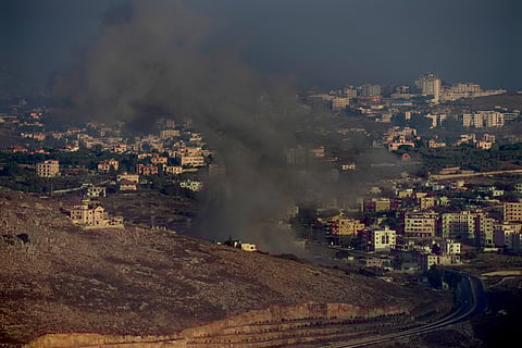 Smoke rises from an Israeli airstrike on Kfar Rouman village, as seen from Marjayoun town, south Lebanon, Monday, Sept 23.