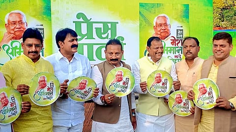 Senior Janata Dal (United) leader and Bihar rural works minister Ashok Choudhary (centre)