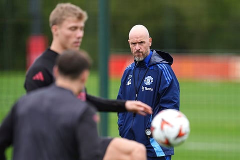 Manchester United manager Erik ten Hag, right, leads a training session at the Carrington Training Complex, Manchester.