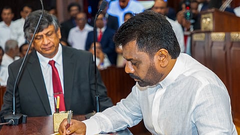This handout photograph taken and released by the Sri Lanka President's Office on September 23, 2024 shows Sri Lanka's new President Anura Kumara Dissanayake attending his swearing-in ceremony, in Colombo.