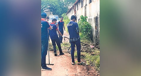 Student volunteers of SD College cleaning the Alappuzha bus depot on Wednesday as part of the waste-free KSRTC campaign