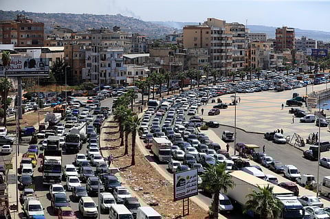 Cars sit in traffic as they flee the southern villages amid ongoing Israeli airstrikes, in Sidon, Lebanon.
