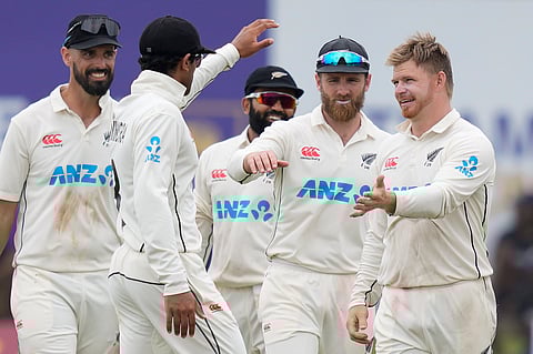New Zealand's Glenn Phillips celebrates the wicket of Sri Lanka's captain Dhananjaya de Silva with teammates during the day two of the first test cricket match between Sri Lanka and New Zealand in Galle.