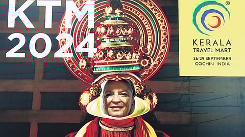 A foreigner tries out the selfie spot at the ongoing KTM 2024 at Samudrika Convention Centre on Friday.