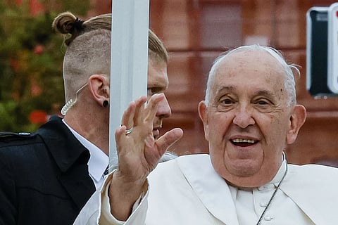 Pope Francis, flanked by security, tours Place de Metz in Luxembourg on the first day of Francis's four-day visit to Luxembourg and Belgium, Thursday, Sept 26, 2024.