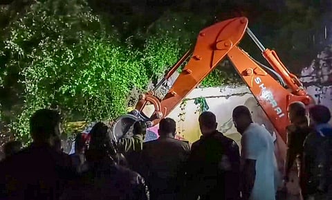 Rescue operation underway after a wall near the Mahakal temple collapses due to heavy rains, in Ujjain, Friday, Sept. 27, 2024.
