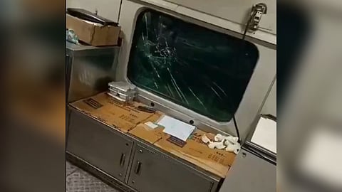 Damaged window of the train after stone pelting.