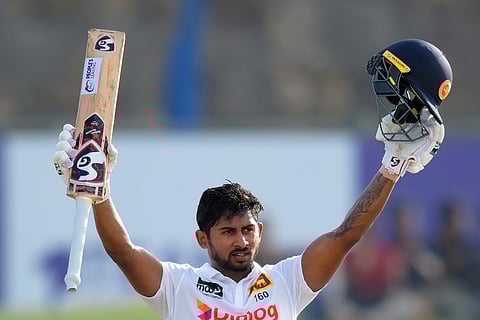 Sri Lanka's Kamindu Mendis celebrates his century on the first day of the first cricket test match between New Zealand and Sri Lanka in Galle.