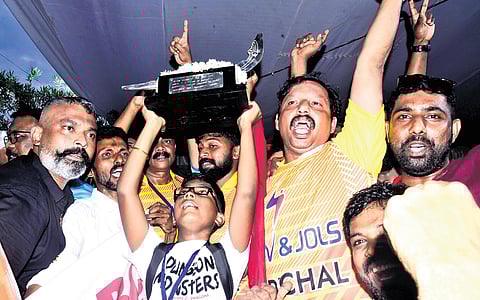 Members of Pallathuruthy Boat Club, which won the 70th Nehru Trophy Boat Race rowing Karichal Chundan, with the trophy on Saturday