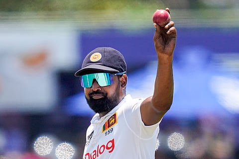 Sri Lanka's Prabath Jayasuriya acknowledges after taking six New Zealand wickets during the day three of the second test cricket match between Sri Lanka and New Zealand in Galle , Sri Lanka, Saturday, Sept. 28, 2024.