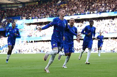 Chelsea's Cole Palmer (centre) celebrates scoring his side's second goal of the game with team-mates during a British Premier League soccer match between Chelsea and Brighton at Stamford Bridge, London, Saturday, Sept. 28, 2024.