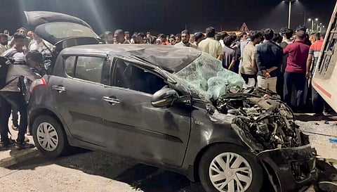 Wreckage of a vehicle after an accident in which 7 people were killed and 15 injured, near Dwarka, Saturday