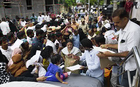 Officials verify Aadhaar details of people affected by Musi Riverfront Development Project for allotment of 2BHK flats, in Hyderabad on Saturday