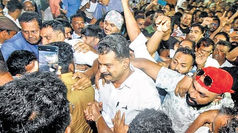 MLA P V Anvar moves amid a crowd of supporters at Chandakunnu near Nilambur in Malappuram on Sunday.
