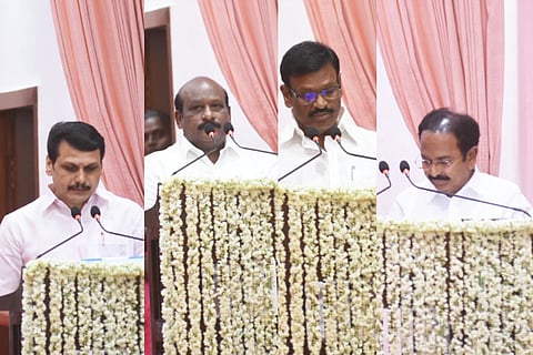 The newly appointed Ministers taking oath during the swearing-in ceremony at Raj Bhavan on Sunday.