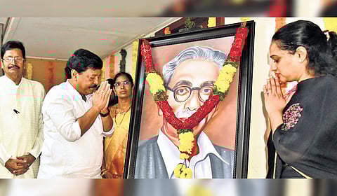 Tourism and Culture Minister K Durgesh paying floral tributes to Gurram Jashuva’s portrait to mark the poet’s 129th birth anniversary in Vijayawada