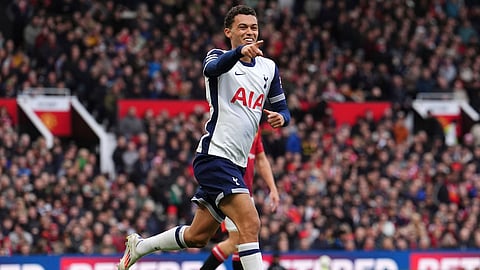 Tottenham's Brennan Johnson celebrates after scoring his side's opening goal during the English Premier League soccer match between Manchester United and Tottenham Hotspur at Old Trafford stadium in Manchester, England, Sunday, Sept. 29, 2024