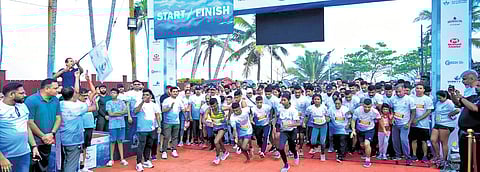An official flags off the 2nd International Kovalam Marathon in Kovalam on Sunday.