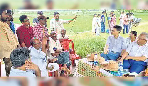 ADB officer Takeshi Ueda interacting with farmers in NTR district