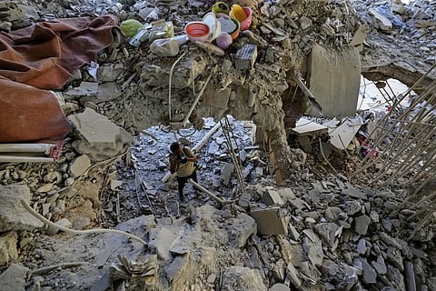 A photographer documents damage in a building that was hit by an Israeli airstrike in Beirut's southern suburb, Lebanon, Monday, Sept 30, 2024.