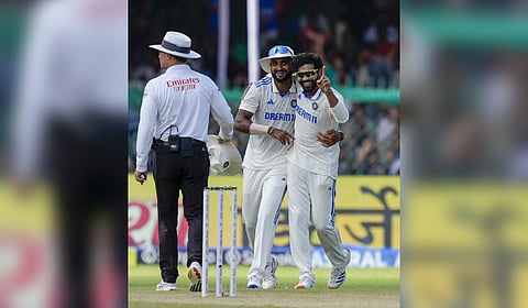 Ravindra Jadeja with teammates celebrates his 300th Test wicket