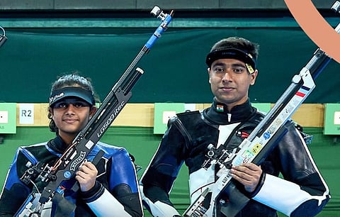 Indian rifle shooters Gautami Bhanot (L) and Ajay Malik