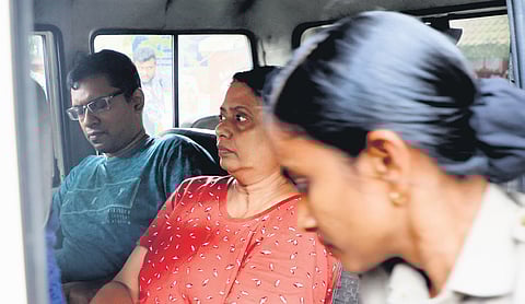 Police take Dolphie Josephine and her son Rohit Saju for a medical examination after arresting them in connection with a multi-crore job fraud case