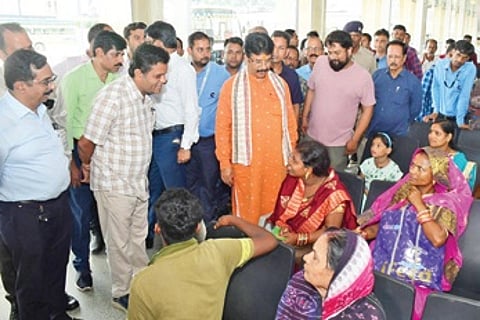 Minister Krushna Chandra Mahapatra interacting with passengers at BSABT, Baramunda