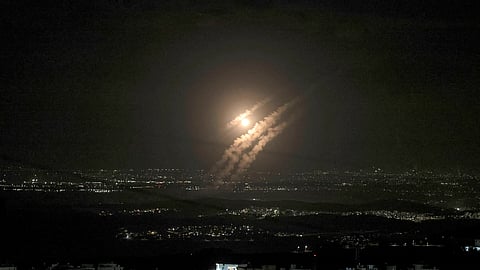 This picture taken from the West Bank city of Hebron shows projectiles above the Israeli city of Ashdod on October 1, 2024.