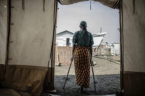 A 42-year-old mother of four who was raped in the Bulengo displacement camp where she had fled war in eastern Congo poses for a photograph Aug. 23, 2023.