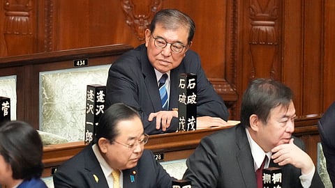 Shigeru Ishiba, top, sits ahead of the extraordinary session of parliament's lower house