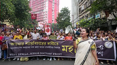 Members of the Bengal Junior Doctors' Front and others take part in a mega rally on 'Mahalaya' to demand justice for the alleged sexual assault and murder of a trainee doctor at RG Kar Medical College and Hospital, in Kolkata, Wednesday, Oct 2, 2024.