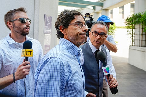 Dr. Mark Chavez, center, a physician from San Diego, who is charged in connection with actor Matthew Perry's death from an accidental ketamine overdose, arrives at the Roybal Federal Courthouse in Los Angeles, Friday, Aug. 30, 2024.